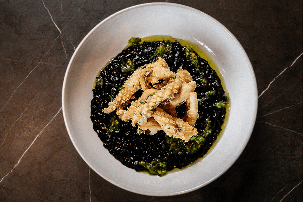 Squid ink risotto, fried cuttlefish, citrus gremolata: Moonee Ponds Restaurant, A La Carte Dining at The Sebel Melbourne Moonee Ponds | Saros Bar + Dining