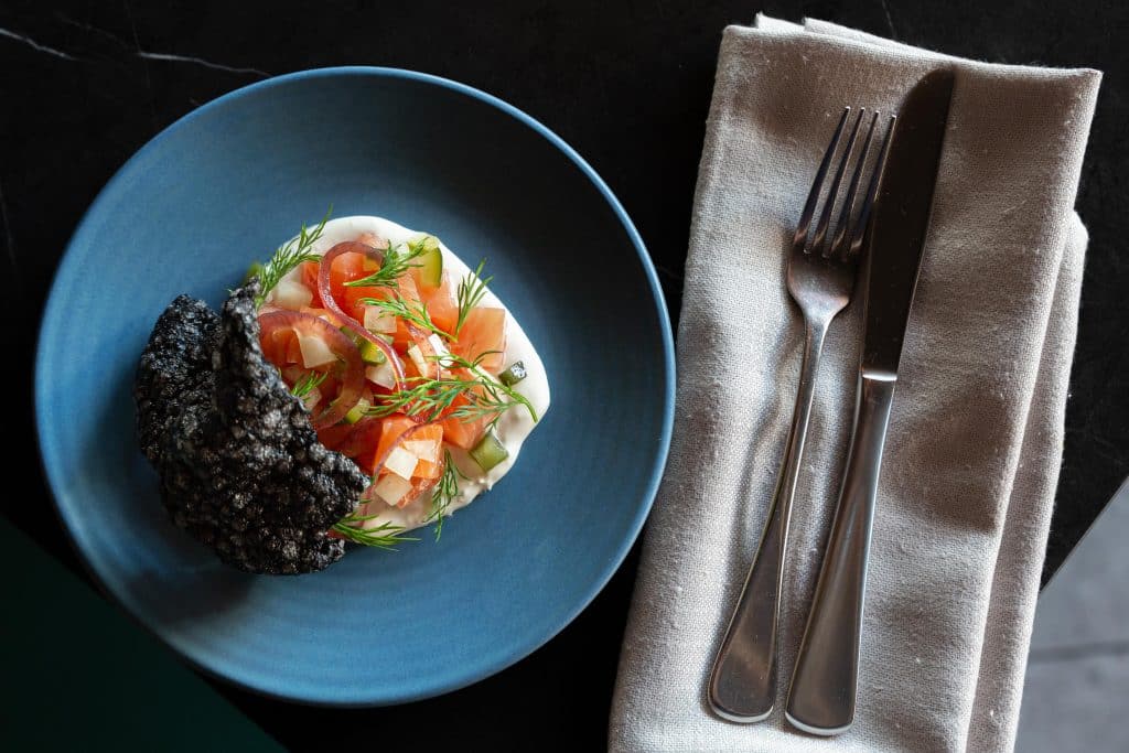 Gin Cured Salmon, Smoked Horseradish Cream, Pickled Vegetables, Squid Ink Cracker (GF) | Moonee Ponds Restaurant and Bar, A La Carte Dining at The Sebel Melbourne Moonee Ponds | Saros Bar + Dining